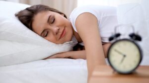 A woman getting proper sleep to reduce Headache
