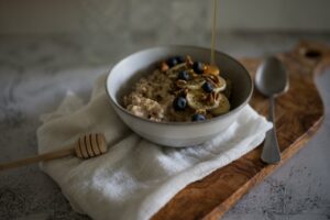 Oatmeal and honey in bowl
